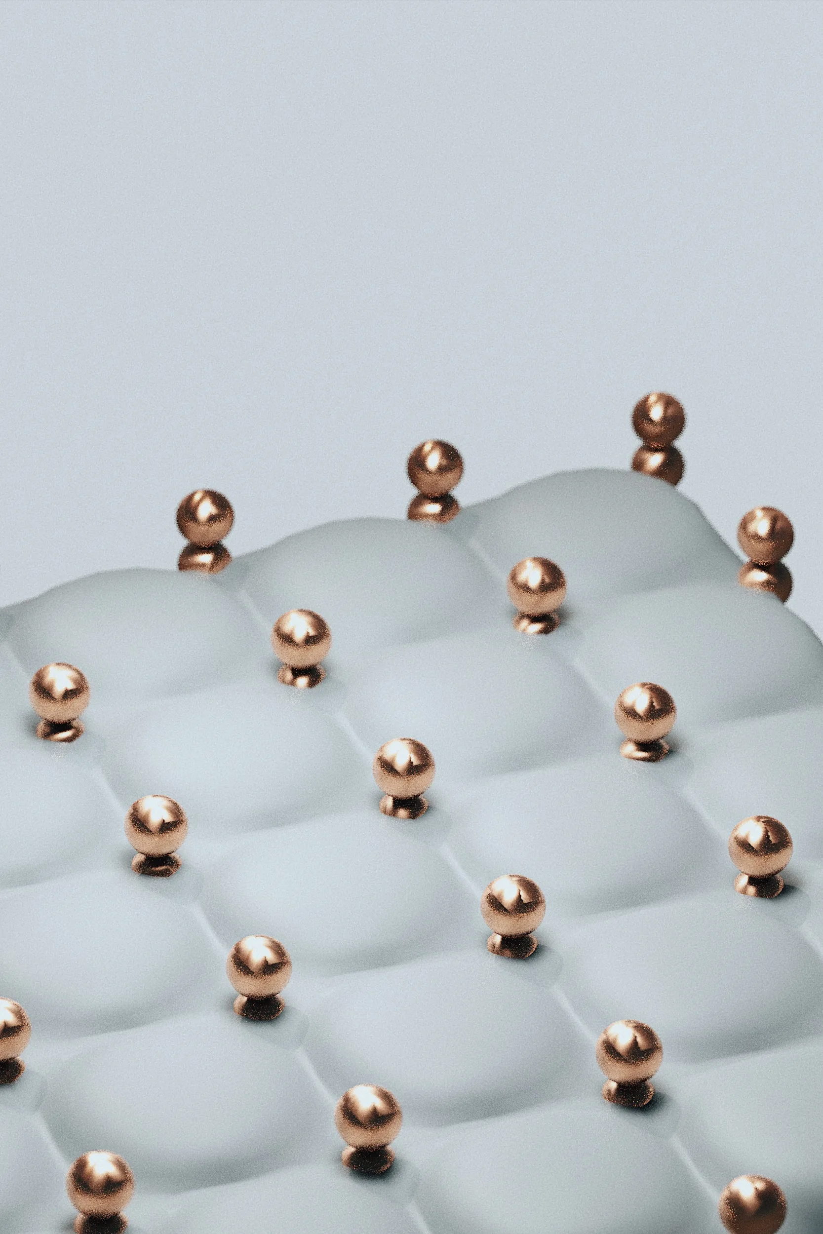 Small copper spheres distributed across a soft white undulating surface.